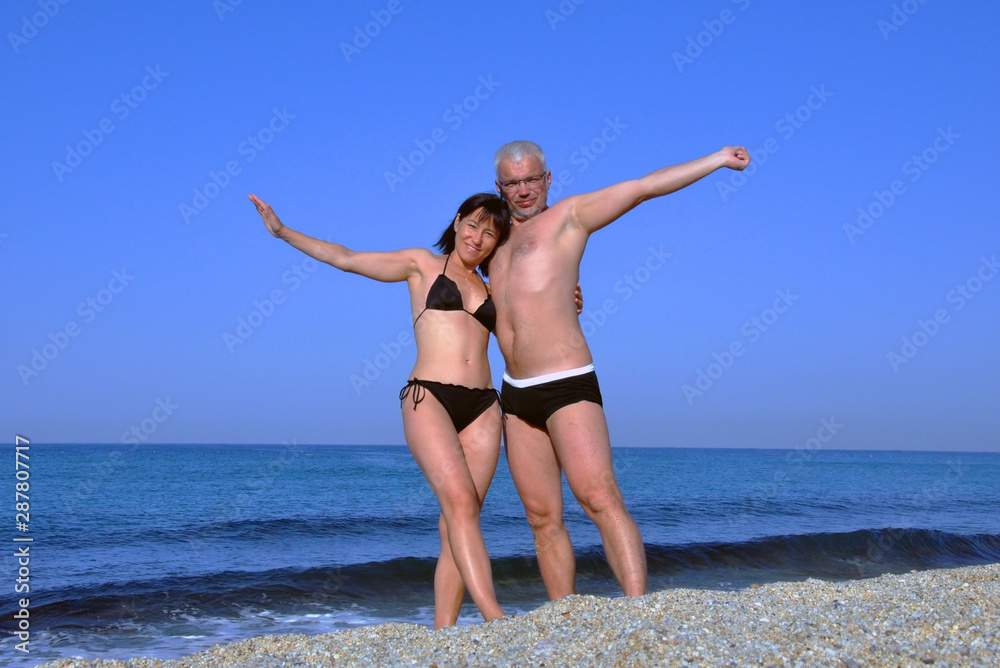 brown lily add Mature Couple Beach photo